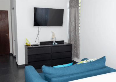 sala con televisión en alojamiento Casa Amatista